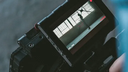 Looking at the viewfinder of a video camera