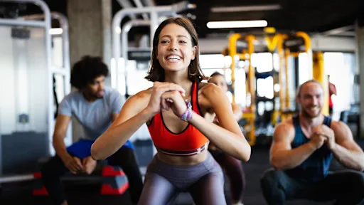 Close up image of attract fit woman in gym